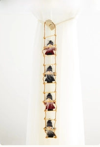 Hanging Christmas ladder ornament with four wool felt Santa dolls in red and grey sweaters