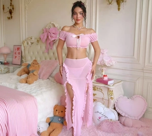Detail of pink sheer mesh sleepwear set featuring ruffled skirt and tie-front crop top