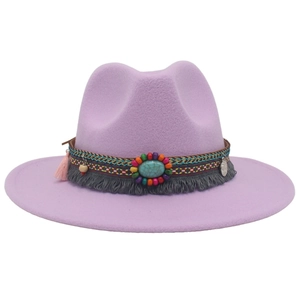 Detail of purple fedora hat featuring turquoise gemstone, colorful beads, and fringe trim