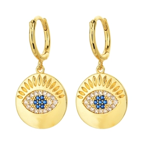 Macro detail of 14K gold-plated Evil Eye hoop earring with blue zircon and radial patterns
