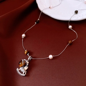 Elegant 18k gold plated tiger eye rocking horse pendant necklace with pearls and zircons