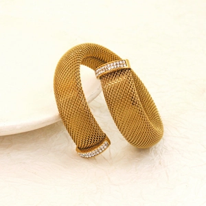 Detailed macro view of 18K gold plated mesh woven bangle with sparkling zircon stones