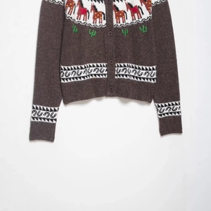 Brown knit cardigan with patterned horse and cactus jacquard and ribbed cuffs