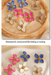Detail of colorful enamel flower earrings on trays with waterproof and anti-fading features