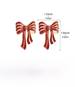 Detailed view of red and gold alloy bow earrings with dimensions 3.4x4.9cm and 17.8g weight