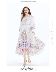 Detail of floral print V-neck maxi dress with long puff sleeves and button-down front
