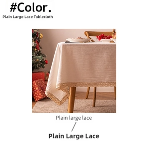Detailed close-up of plain beige tablecloth with large hollowed-out lace embroidery