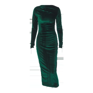 Macro detail of dark green velvet fabric with pleated texture on long sleeve dress