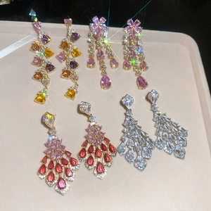 Detailed display of luxury silver needle zircon fringe earrings with various gemstone cuts
