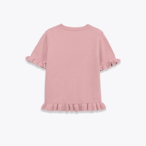 Detail view of the pink knit top back featuring elegant ruffle trim and fine texture