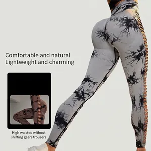 High-waisted tie-dye yoga pants with side hollow lace-up detail and peach lift effect