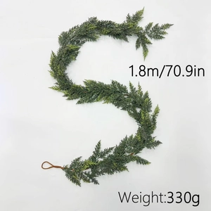 Detail of 1.8m lifelike green Norfolk pine garland showing flexible soft rubber texture