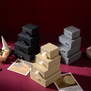 Glitter jewelry drawer boxes in black gold and silver with tiered sizes for rings and necklaces