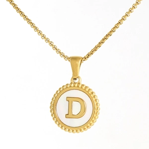 Close-up of 18K gold stainless steel circular pendant with letter D and shell inlay