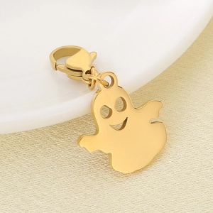 Macro view of a gold ghost pendant with lobster clasp for keychains and accessories