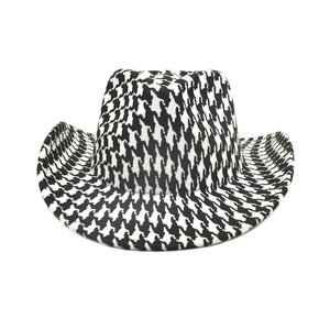 Detailed view of the houndstooth pattern fabric on a classic western cowboy fedora hat