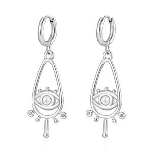 Chic silver eye drop earrings with pearl and zircon inlay on a crisp white backdrop