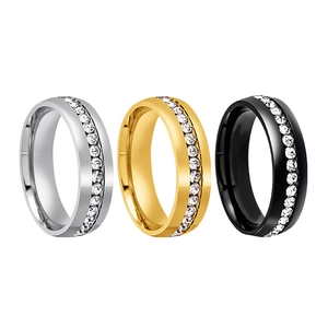 Three-piece stainless steel eternity ring set in gold, silver, and black with inset crystals