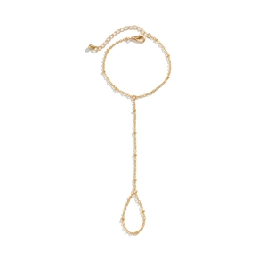 Detailed shot of golden link slave bracelet with lobster clasp and adjustable chain