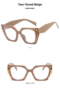 Detail view of beige cat-eye frames with stylish dark tortoise shell temple accents