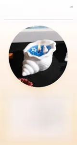 Macro shot of conch candle featuring blue jelly wax with sea shells and starfish details