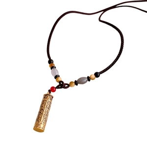 Tiger eye beaded necklace with golden cylindrical scripture pendant on brown woven cord