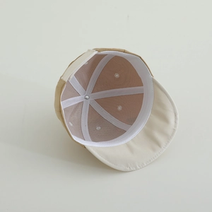 Detail of baby sun hat showing breathable mesh lining and reinforced inner stitching