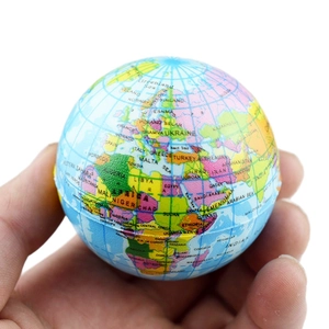 Detailed close-up of a hand-held PU foam stress ball with a printed world map and text