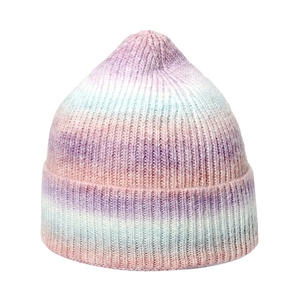Close-up of fine ribbed texture on a pink and blue gradient knit beanie hat