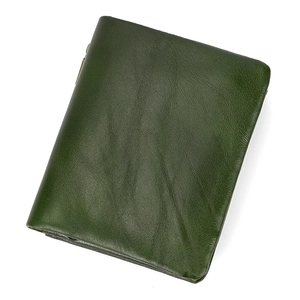 Close-up of a green bifold leather wallet showing smooth natural texture and stitching