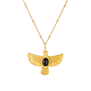 Golden bead chain necklace with hawk pendant featuring an oval black gemstone inlay