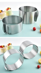 Macro view of adjustable stainless steel mousse rings for baking layered cakes and desserts