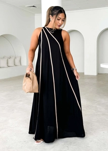 Detailed view of women's sleeveless maxi dress with diagonal beige stripe on black fabric