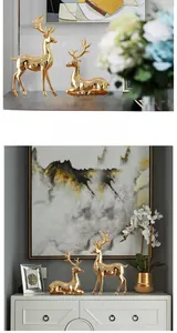 Close-up of elegant gold elk statues for luxury home decor on display stands