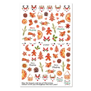 Christmas nail art stickers featuring watercolor reindeer, gingerbread men and snow trees