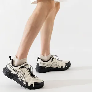 Men's mesh breathable sneakers in black and white with thick anti-slip sole shown on feet