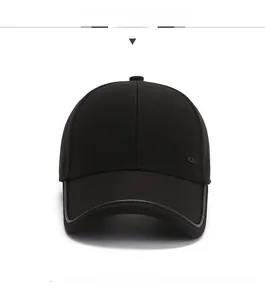 Detail view of the black cotton fabric and HLS logo on this men's outdoor baseball cap