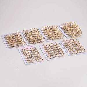 Set of seven pairs of 18K gold plated stainless steel hoop earrings in various sizes
