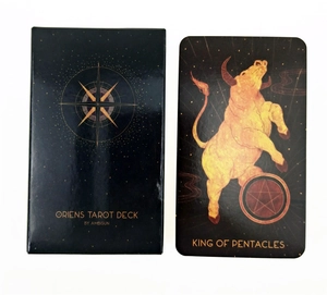 Close-up of Oriens Tarot Deck box and King of Pentacles card on white background