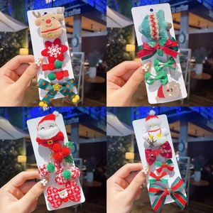 Set of Christmas hair clips for girls featuring reindeer and festive holiday designs