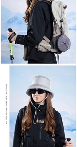 Silver-grey insulated bucket hat featuring adjustable windproof cords for winter warmth