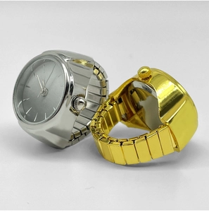 Detail of creative gold and silver finger watch rings with elastic stretch band