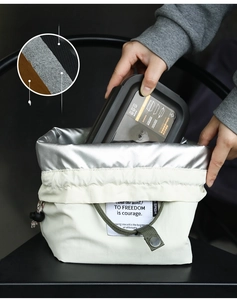 Detail of insulated lunch bag with drawstring closure and 630ml meal container box