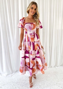 Abito midi con stampa geometrica rosa e arancione, maniche a sbuffo e corpetto smock
