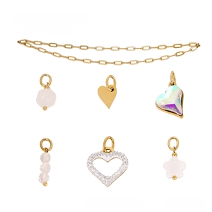 Detailed set of gold stainless steel DIY jewelry pendants including hearts and crystals