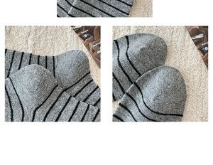 Detail view of gray and black striped wool socks with high-quality knit texture