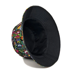 Fashionable reversible bucket hat with colorful tiki floral print and black inner lining