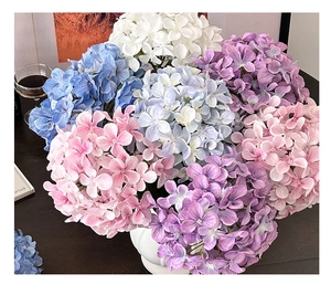 Close-up of realistic 3D printed hydrangeas in a white vase with interior decor
