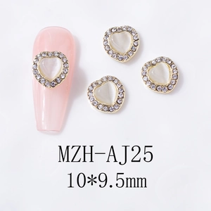 Detailed macro view of 10x9.5mm heart shaped opal nail art charms with golden diamond borders