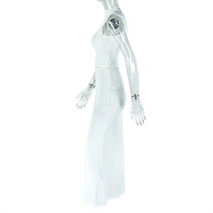 Detail shot of white sleeveless slim-fit maxi dress on model, featuring textured fabric